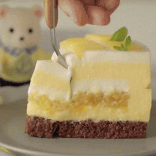 Person Cutting Cake with Fork
