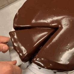 Person Cutting Chocolate Cake