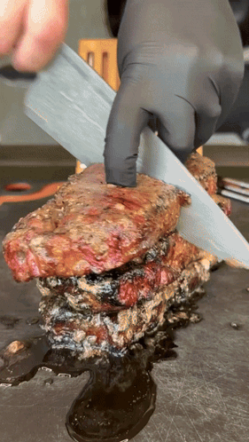 Person Cutting Meat with Knife