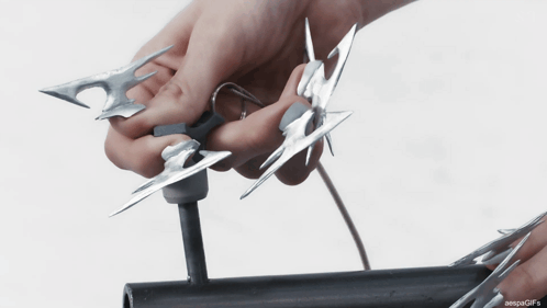Person Cutting Metal With Scissors GIF