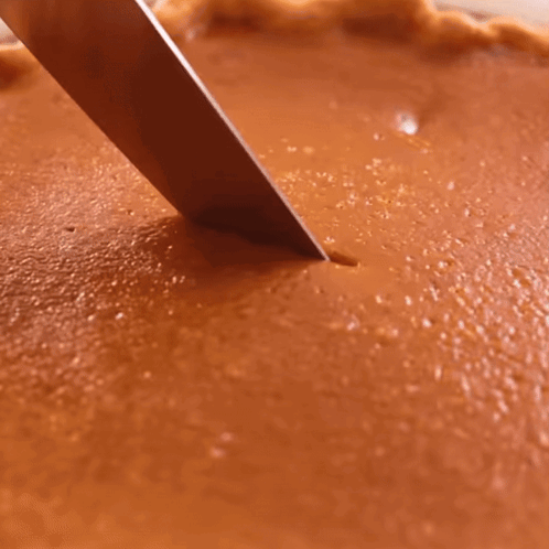 Person Cutting Pumpkin Pie With Knife GIF