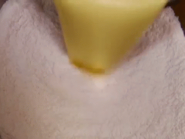 Person Cutting Quesadilla in Half