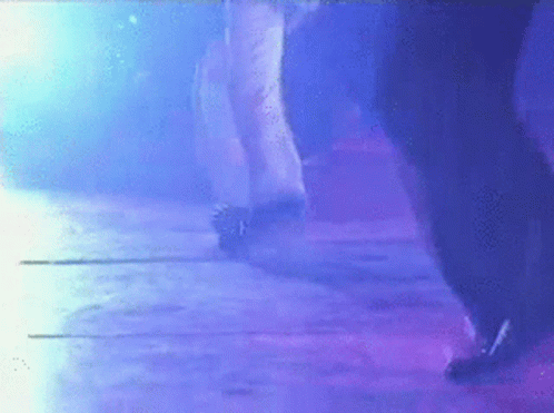 Person Dancing In Dark Room With Purple Lights GIF