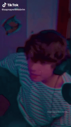Person Dancing in Dark Room