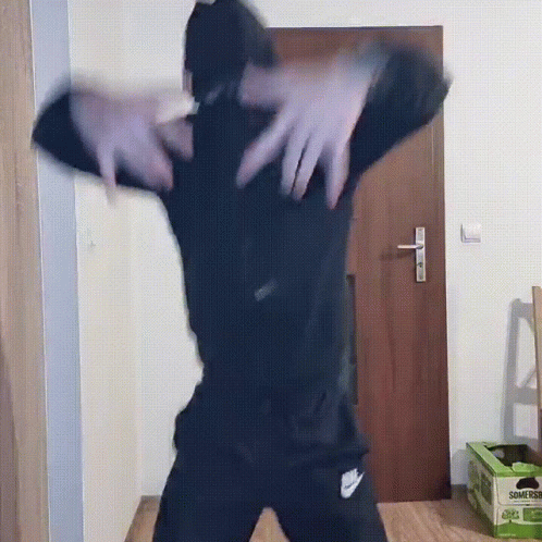 Person Dancing in Front of Door With Somersby Bananas Box
