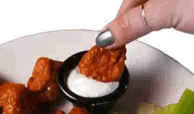 Person Dipping Chicken in Ranch