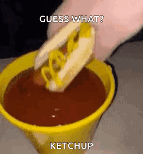 Person Dipping Hot Dog In Ketchup GIF
