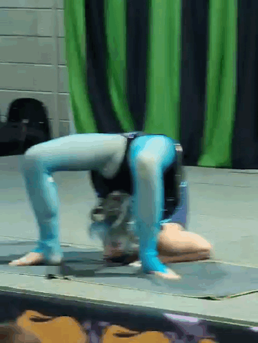 Person Doing Handstand on Stage