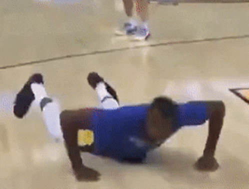 Person Doing Push Ups On Basketball Court GIF