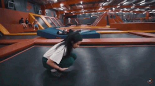 Person Doing Trick on Trampoline