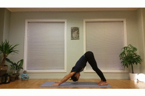 Person Doing Yoga Pose on Mat