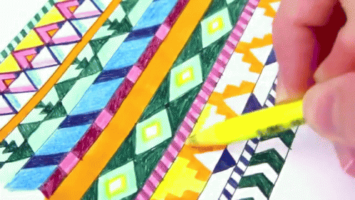 Person Drawing Colorful Geometric Pattern with Yellow Pencil