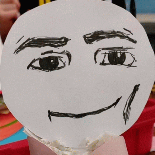 Person Drawn Face on Cupcake with Chocolate Chips