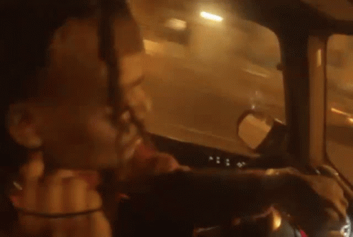 Person Driving Car Talking on Phone