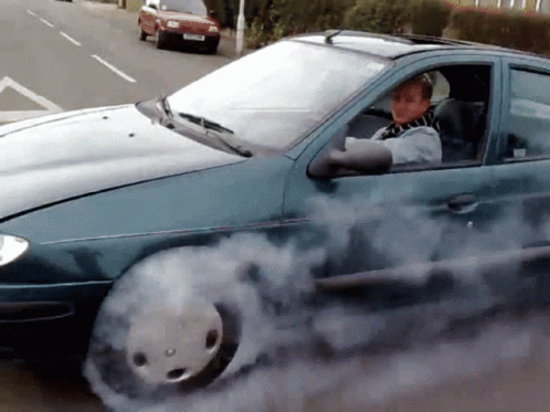 Person Driving Car With Smoke From Tire GIF