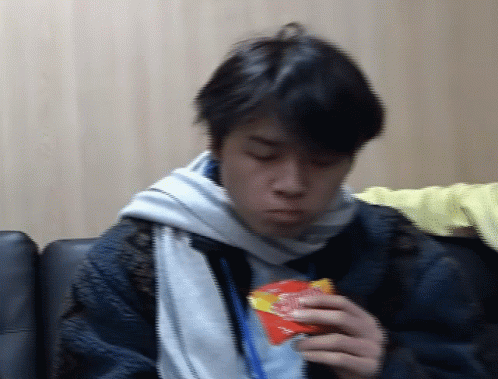 Person Eating Packet of Chips