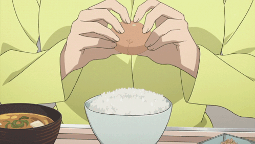 Person Eating Rice and Eggs