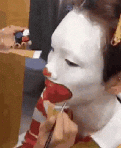 Person Getting Clown Face Paint