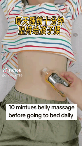 Person Giving Child Belly Massage Before Bed
