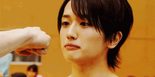 Person Giving Fist Bump to Young Man