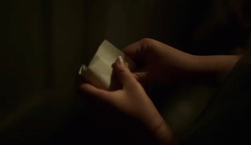 Person Holding A Piece Of Paper That Says In Here GIF