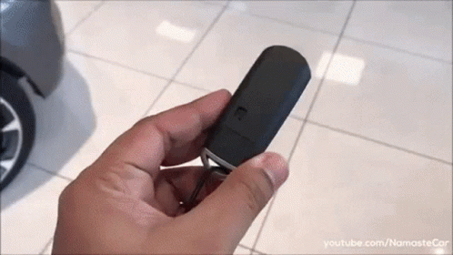 Person Holding Black Car Key GIF