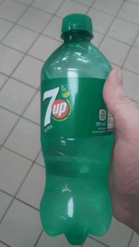 Person Holding Bottle Of 7Up GIF