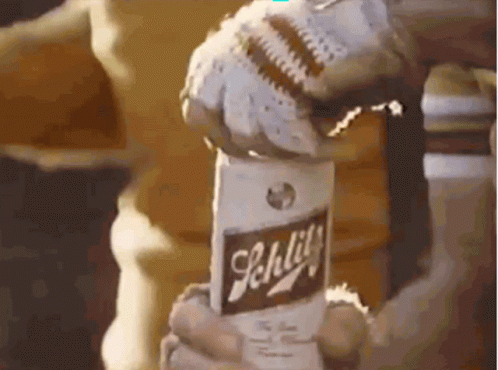 Person Holding Bottle of Schlitz