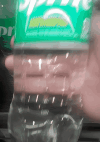 Person Holding Bottle of Sprite