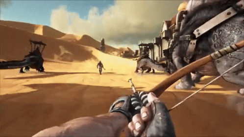 Person Holding Bow And Arrow In Front Of Rhino In Desert GIF