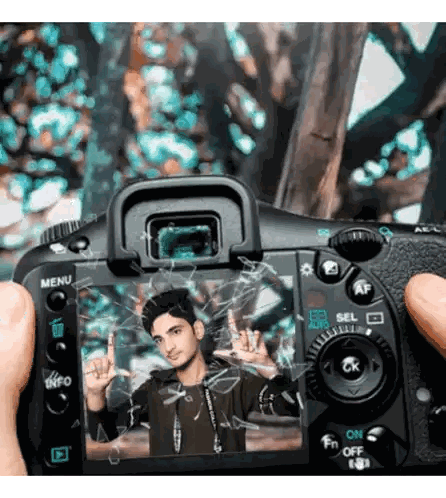 Person Holding Camera with Young Man Photo