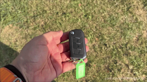 Person Holding Car Key With Green Tag Youtube