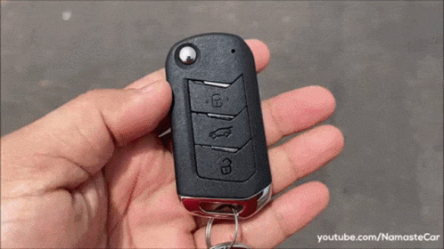 Person Holding Car Key with youtube.com/namastecar
