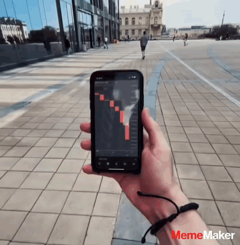 Person Holding Cell Phone With Graph Mememaker Logo