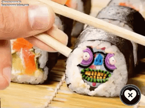 Person Holding Chopsticks Over Sushi With Face GIF