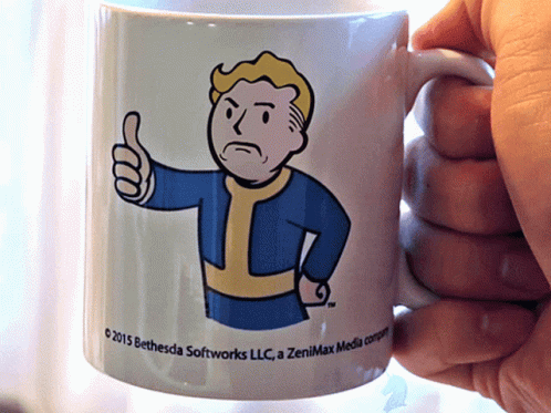 Person Holding Coffee Mug Saying 2015 Bethesda Softworks LLC