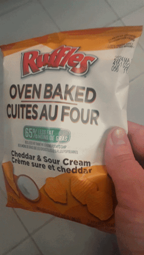 Person Holding Cookie With Insider Written On Bottom GIF