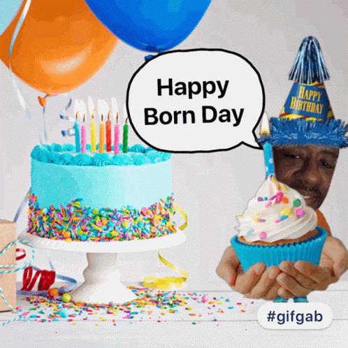 Person Holding Cupcake With Birthday Hat
