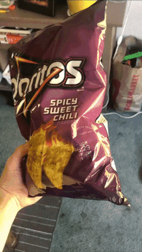 Person Holding Doritos Spicy Sweet Chili