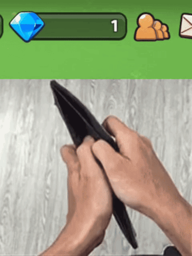 Person Holding Empty Wallet in Front of Green Bar Number 1