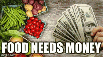 Person Holding Fan Of Money Next To Fruit And Vegetables GIF