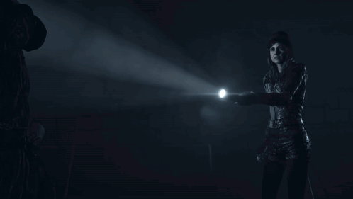 Person Holding Flashlight In Dark GIF