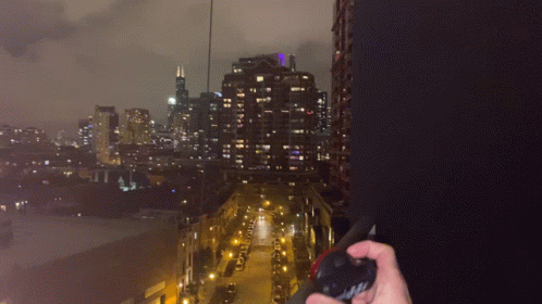 Person Holding Flashlight With Chicago Lanyard GIF