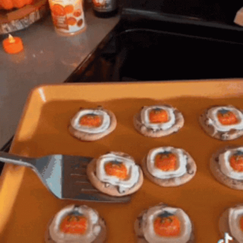 Person Holding Fork Over Tray Of Cookies GIF