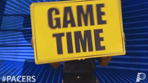 Person Holding Game Time Sign