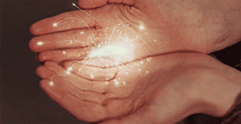 Person Holding Glowing Sparkler GIF
