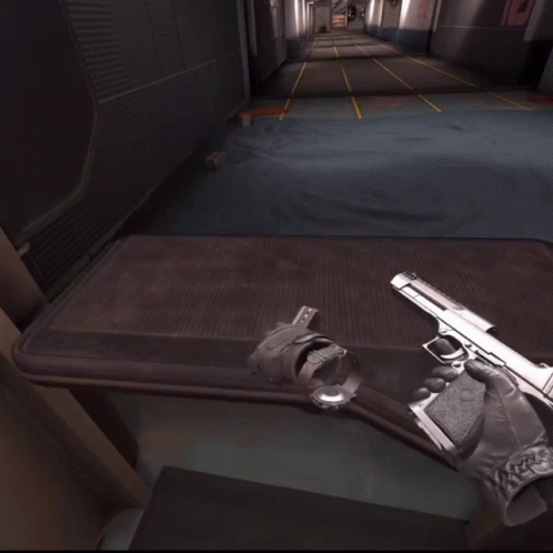 Person Holding Gun at Shooting Range