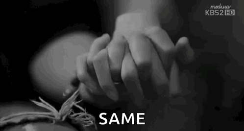 Person Holding Hands With Same Text GIF
