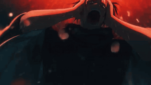 Person Holding Head In Dark Room GIF