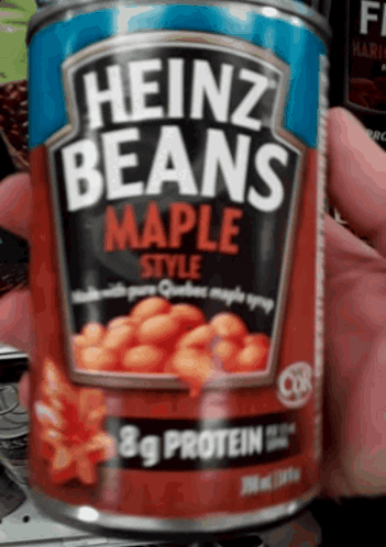 Person Holding Heinz Maple Style Beans Can